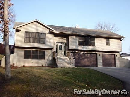 Front View #1
						:
						Raised ranch design with large three car garage.