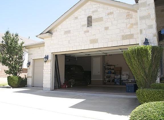 Spacious 3 car garage. The 3rd car part is even big enough to fit a full size truck in.