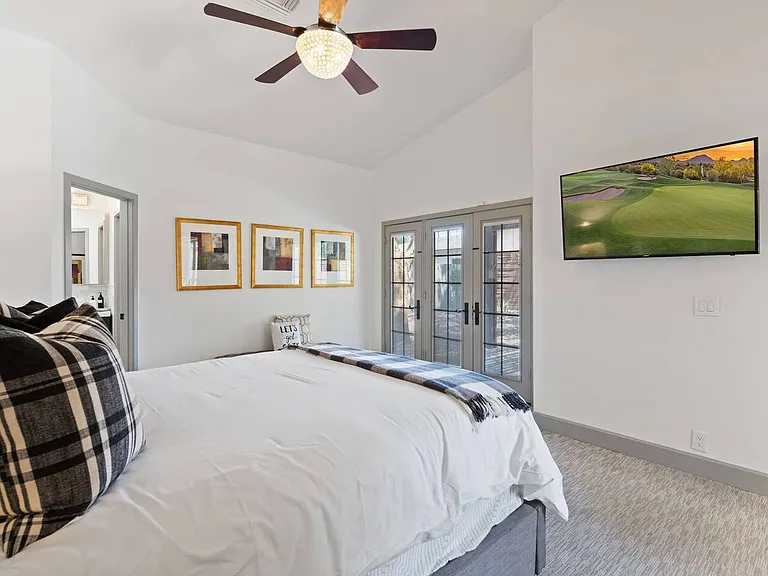 Master bedroom - doors to private patio in backyard