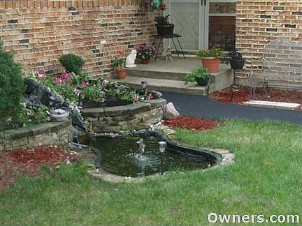 Front entrance pond/flower waterfall