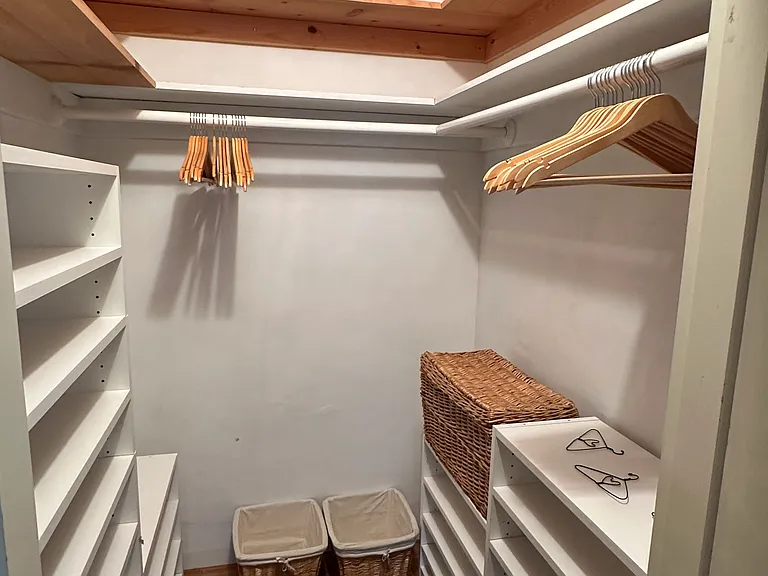 Walk in closet in primary bedroom