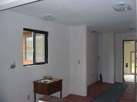 Left side of kitchen area-behind short wall xtra room.