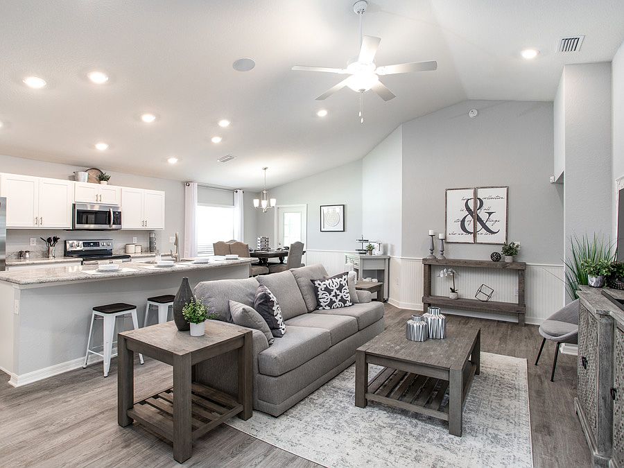Spacious and welcoming gathering room - New home for sale in Lake Alfred, FL. Photo showcase a model