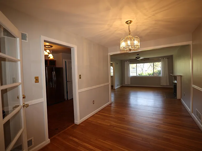 Dining room, living room, and entry to kitchen