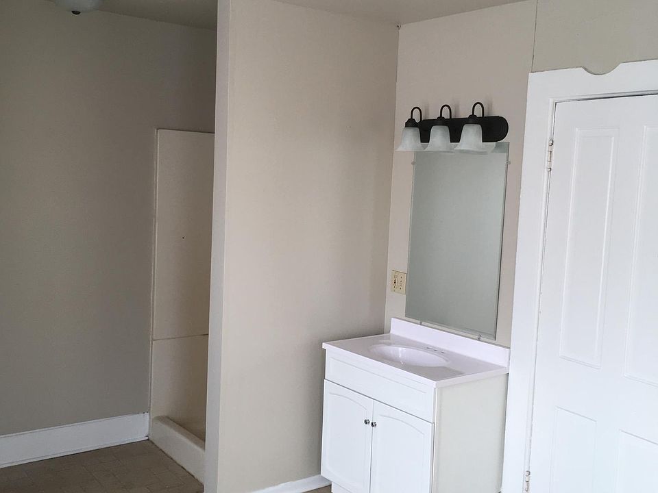 sink and shower shared with bedroom