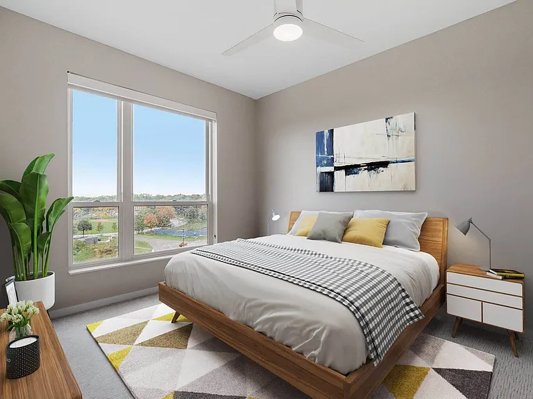Spacious bedroom with bright natural light at The Hallon Luxury Apartments in Hopkins MN