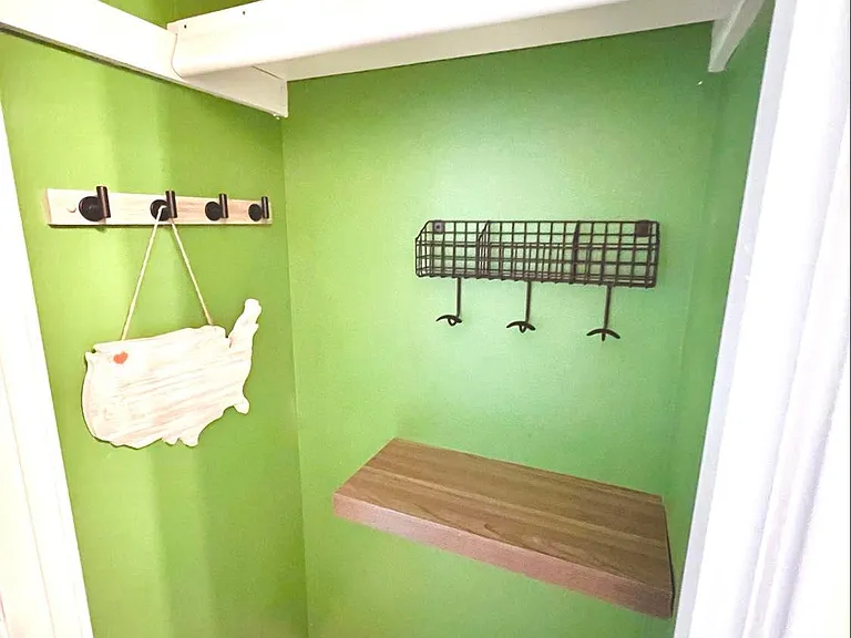 Closet nook for shoes, keys, mail, hat and coat storage. Room for umbrellas. Perfectly situated just off entry of house.