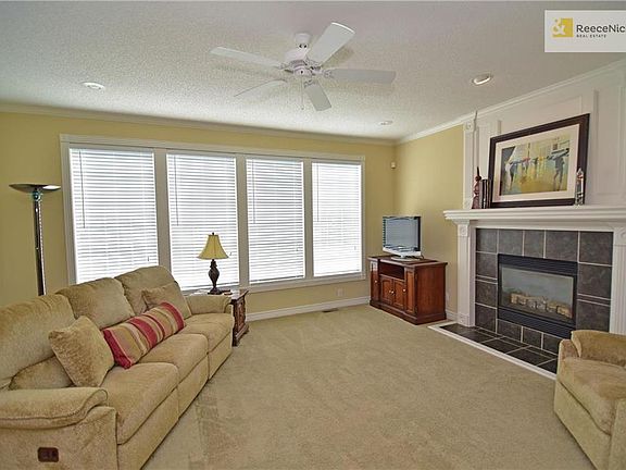 Wall of windows to enjoy views of the deep backyard. Gas log fireplace to easily create a cozy ambiance!