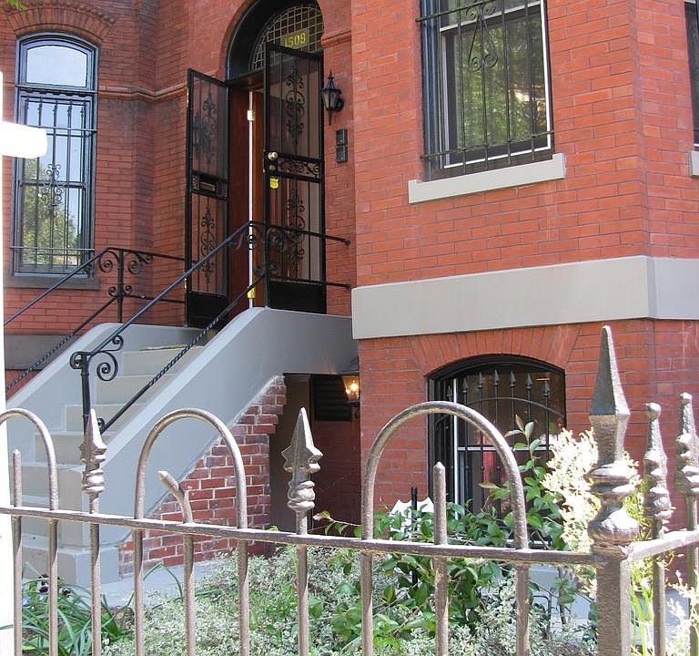Front of building; separate entrance to unit 1 below main stairs