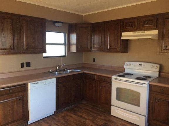 lots of cabinets, gas range, dishwasher and fridge provided