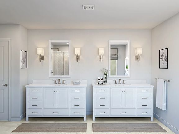 Primary bath with dual freestanding vanities