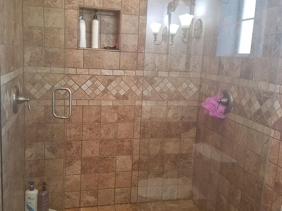 master bathroom with 2 shower heads one on each wall