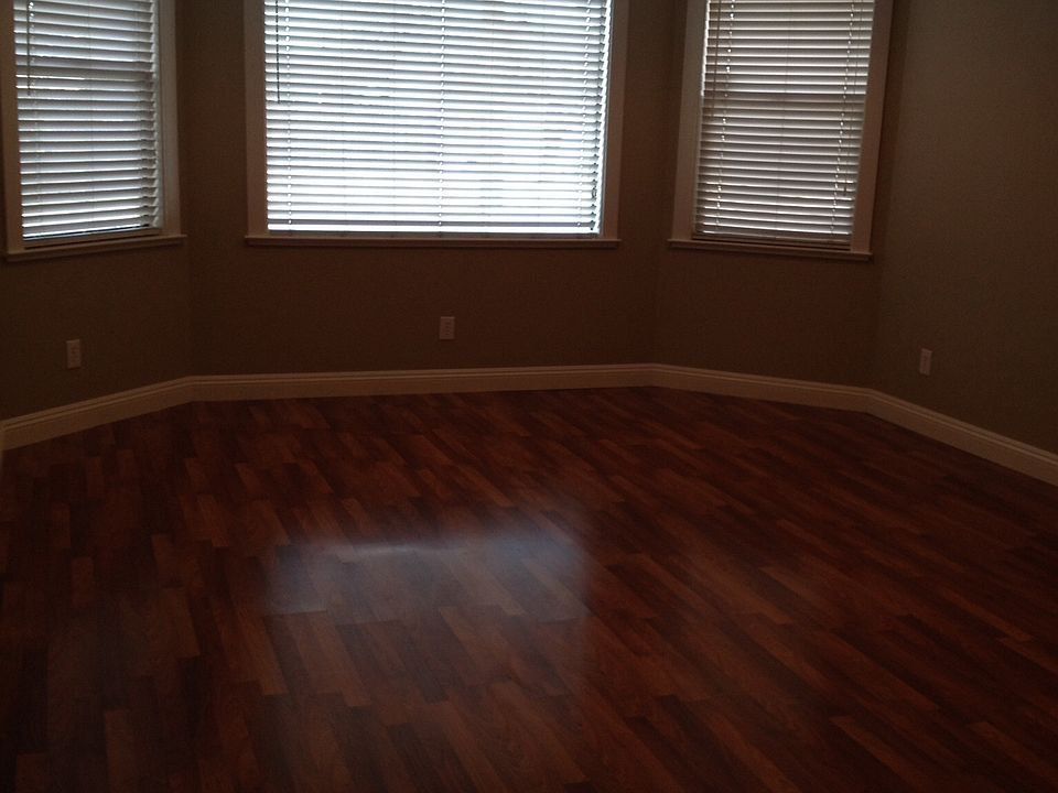 Spacious living room with laminate flooring