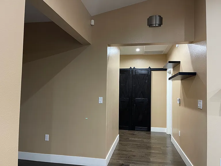 Hallway to Bedrooms with view of Linen Closet in the background