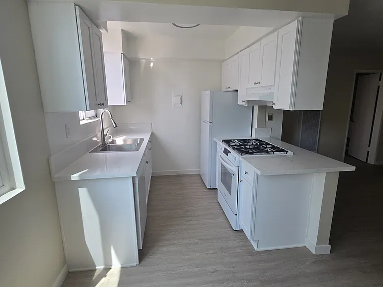 #205 - BRAND NEW renovated kitchen with ALL-NEW countertop, cabinets and appliances! $1925 with Rent Special: Half-off One Month's Rent!