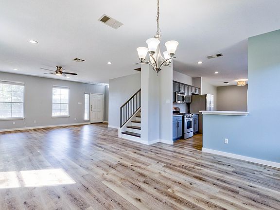 Spacious and welcoming living room and dining area, with brand new white Oak flooring.