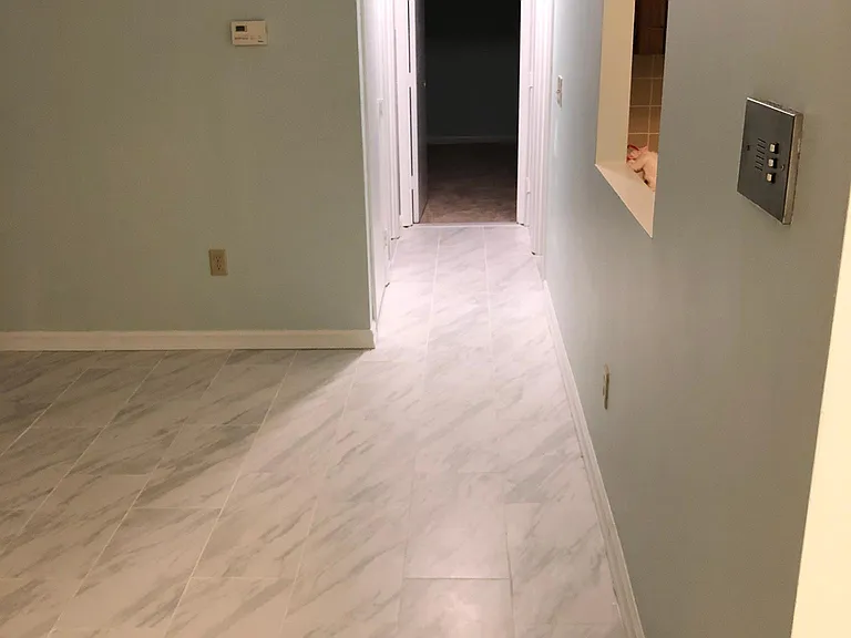 Hallway leading to the bathroom and bedrooms. Photo taken at
