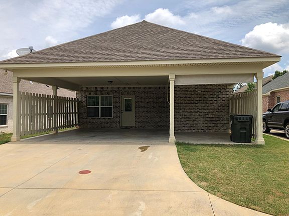 2 car garage with attached gathering area