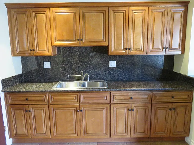 View is of kitchen, across from stove/range.
