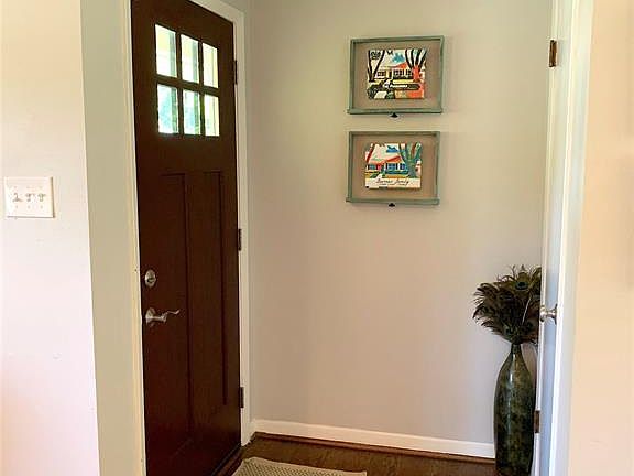 Front entry. Coat closest by front door.