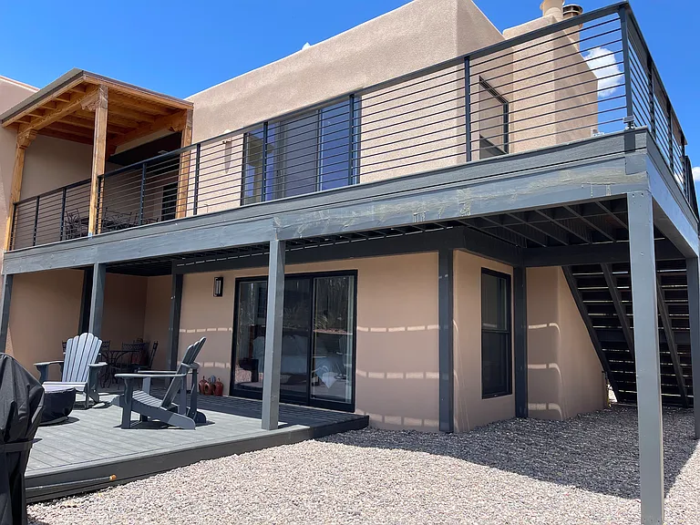 View of the back of the house including upper and lower decks