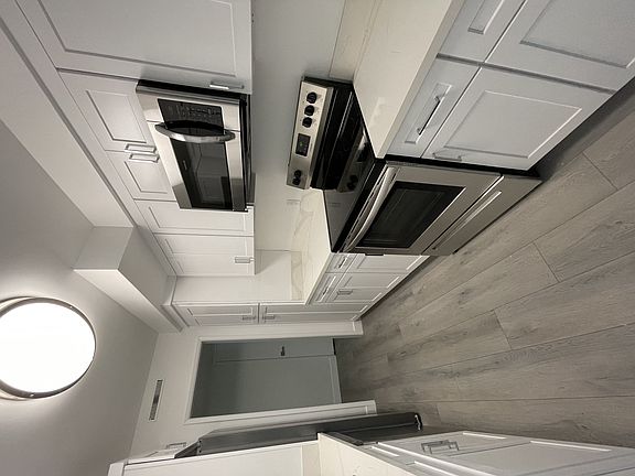 Kitchen with White Cabinets and Stainless Steel Appliances