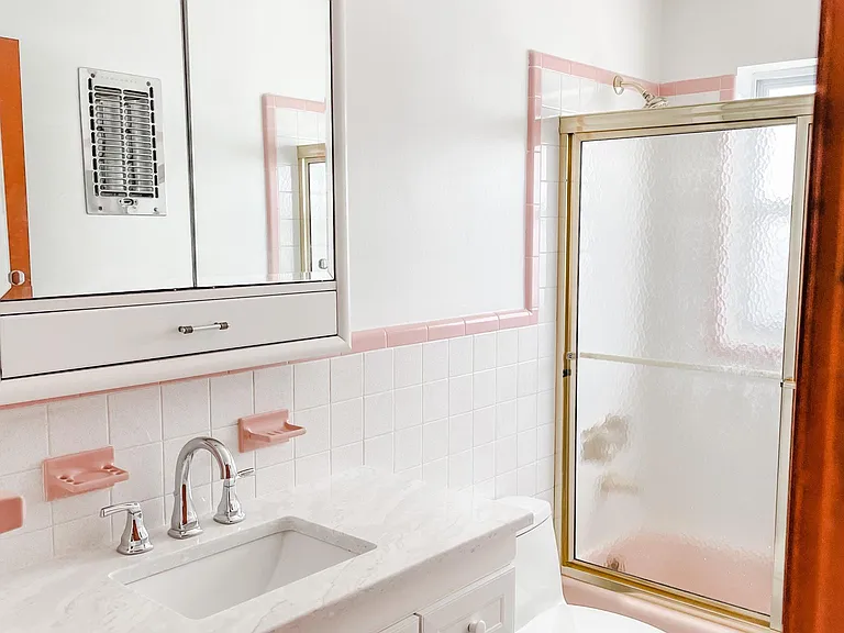 Full bath has tub and shower. New vanity and toilet.