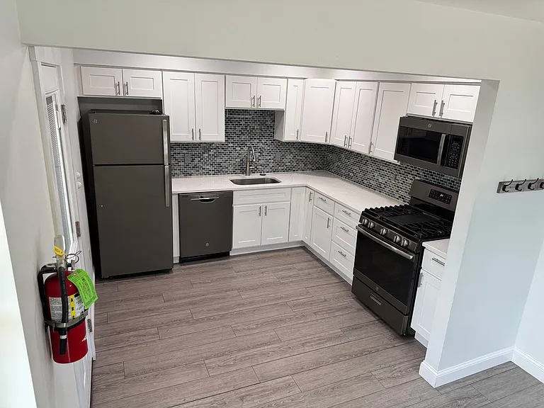 Kitchen - Quartz countertops, gas range, and dishwasher included