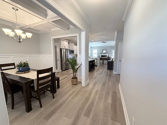 Entryway, dining room, and kitchen