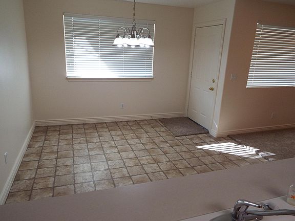 Looking from Kitchen to Dining Room, with door leading to outside personal Covered Patio and yard area