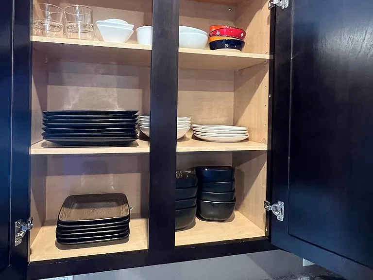 One or many cabinets w dishware.