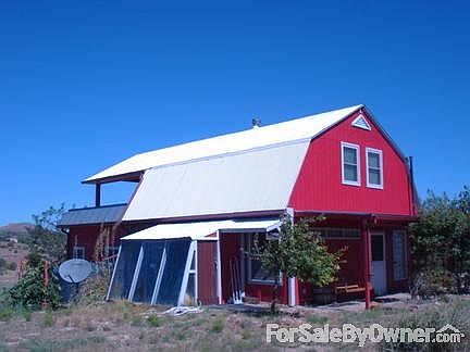 Delightful farmhouse on corner lot
						:
						South side passive solar greenhouse & rainwater catchment for sustainable garden