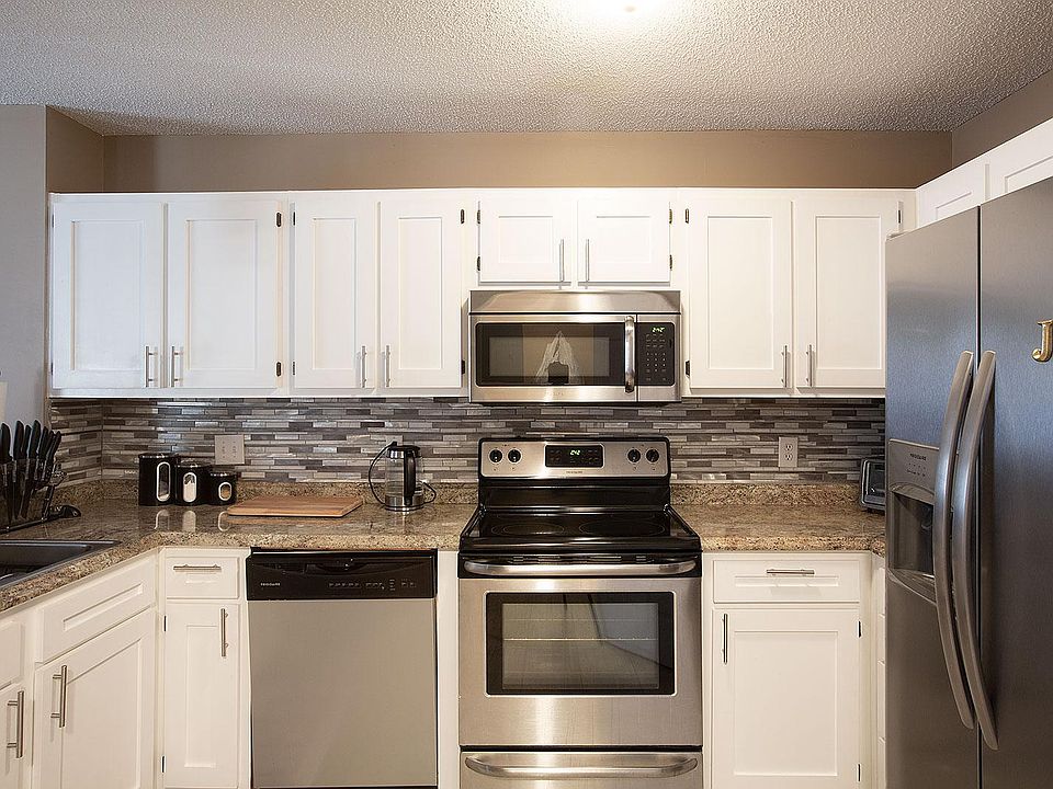 Recently renovated kitchen w/granite look counter tops, custom strip mosaic tile back splash and a full suite of SS appliances