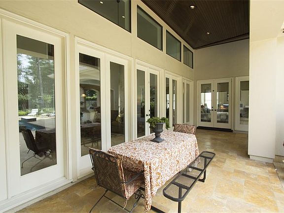 Dine al fresco and enjoy views of the pool and lovely reserve in privacy.