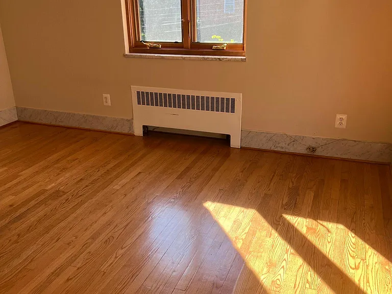 second bedroom with hardwood floors