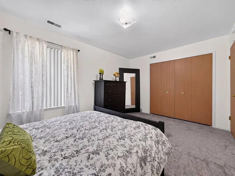 Spacious bedroom with ample storage space at Eastwood Village Apartments in Clinton Township, MI.
