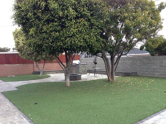 fully fenced backyard with high quality artificial grass (ea