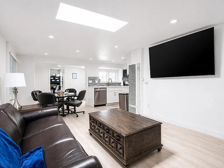Spacious living area with smart TV and open layout