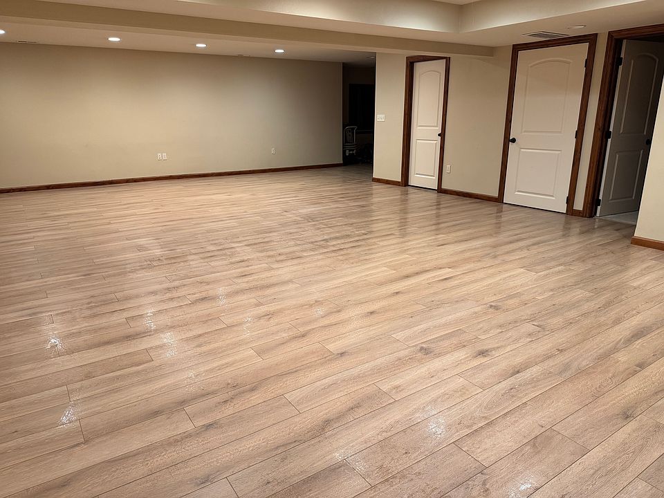 View coming out of master bedroom looking towards kitchen far left, bathroom door, laundry door and 2nd bedroom.