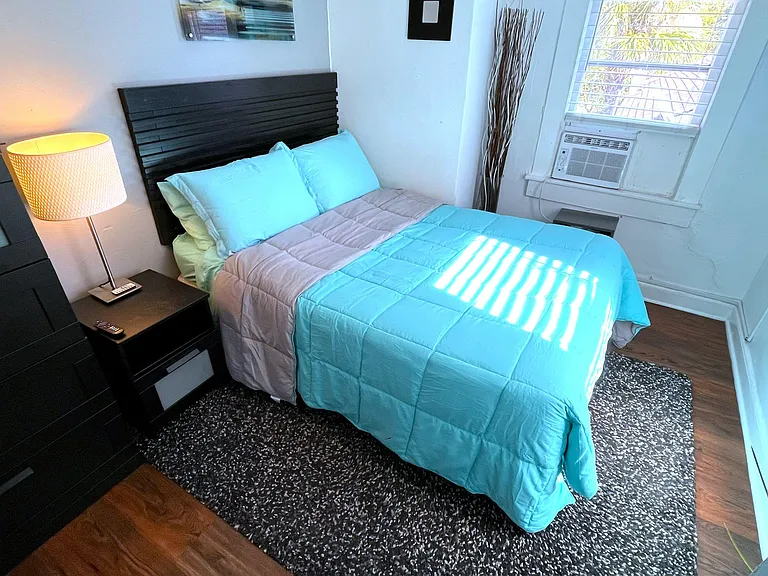 Features: Full bed, 55" Roku Smart TV, Personal AC, Ceiling fan, dresser, night stand with lamp and shag rug
