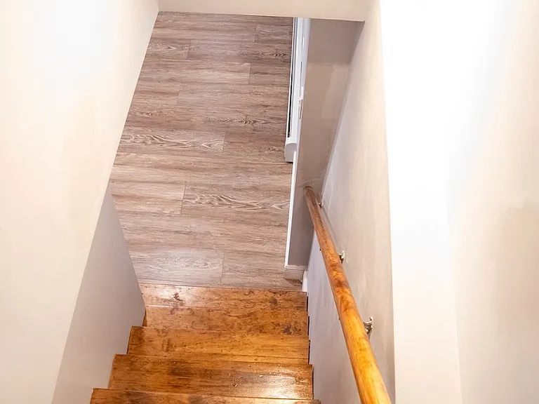 Stairs leading from kitchen to basement