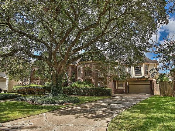 The home has great curb appeal, 2-car garage, and porte-cochere.