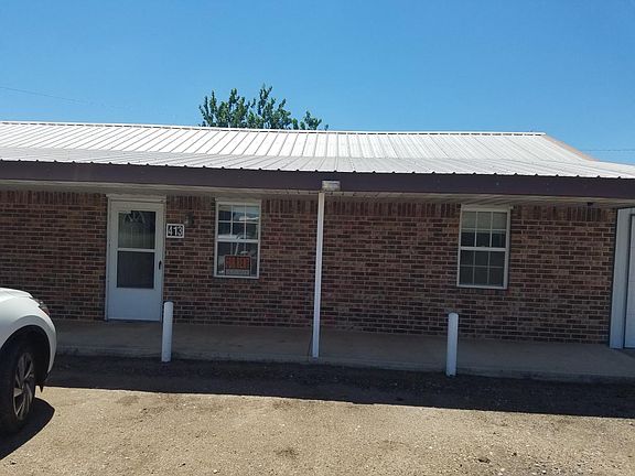 Front of apartment and edge of garage