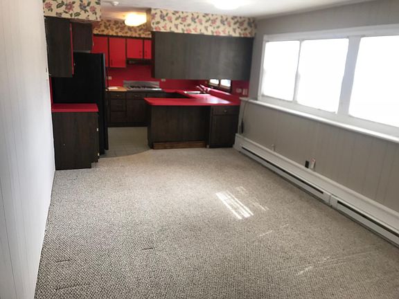 LR and kitchen with island to dine at.