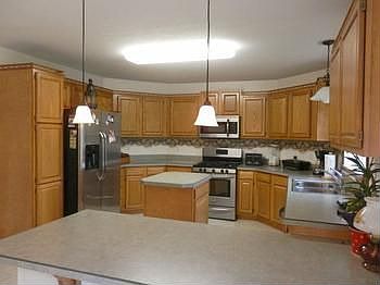 Large open kitchen includes all newer stainless appliances....lots of cabinets