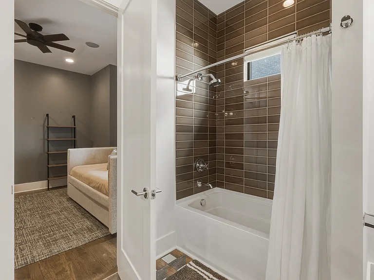 Bathroom #2 is attached to both Bedroom #2 & 3 with dual vanities + shower/tub combo.