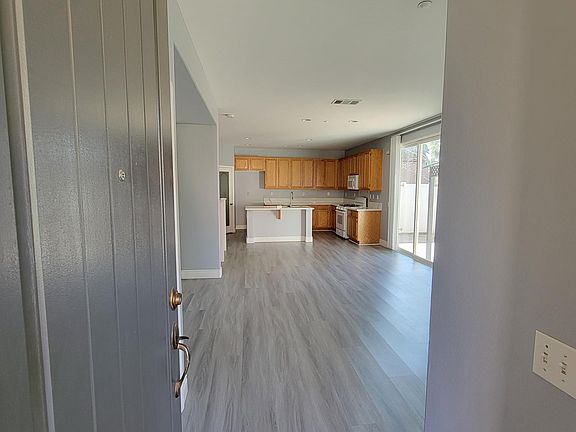 Front door entrance - open floor plan with living room, dining and kitchen. Office off to the immediate left of the entrance.