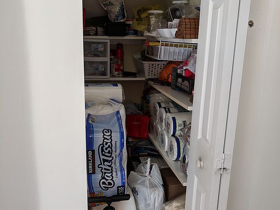 Storage closet below stairs
