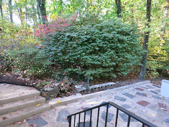 Patio has pathway to the side & front yards.