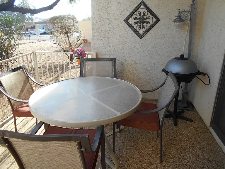 View of Covered/Shaded Patio & Mountain Views. Grill and party lights for nighttime